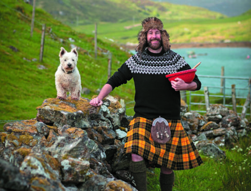 Hebridean Baker Coinneach MacLeod with mixing bowl, spurtle and trusty West Highland terrier Seoras.