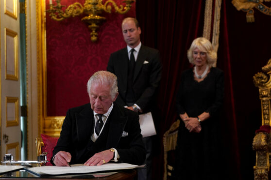 King Charles signs formal oath with his wife Camilla and son William at ceremony yesterday