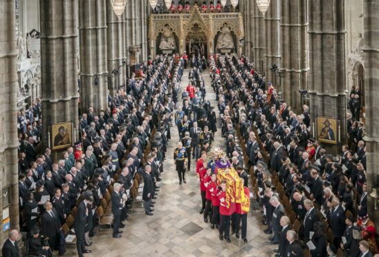 The coffin of Queen Elizabeth is carried from Westminster Abbey after her funeral service on Monday when Sir James MacMillan’s Who Shall Separate Us? was heard for the first time.