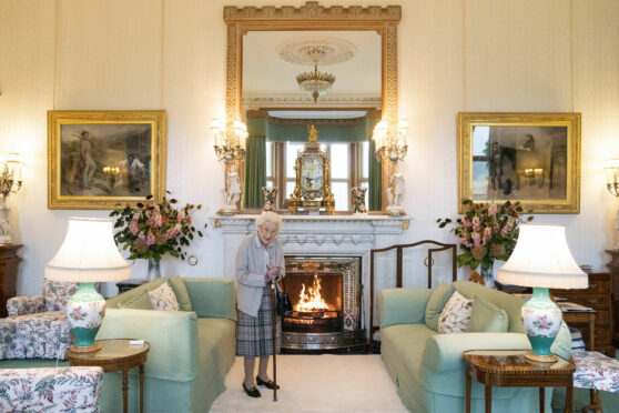 The Queen waits to greet Liz Truss, the 15th prime minister of her reign, in the drawing room at Balmoral on Tuesday