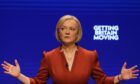 Liz Truss addresses members at the Tory conference earlier this month in Birmingham