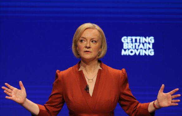 Liz Truss addresses members at the Tory conference earlier this month in Birmingham