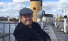 Actor Robbie Coltrane on board the Clyde steamer Queen Mary, which he helped rescue and restore