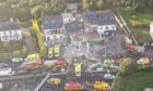 Police, fire service and ambulances at the scene yesterday after a huge explosion destroyed a petrol station in Creeslough, Donegal