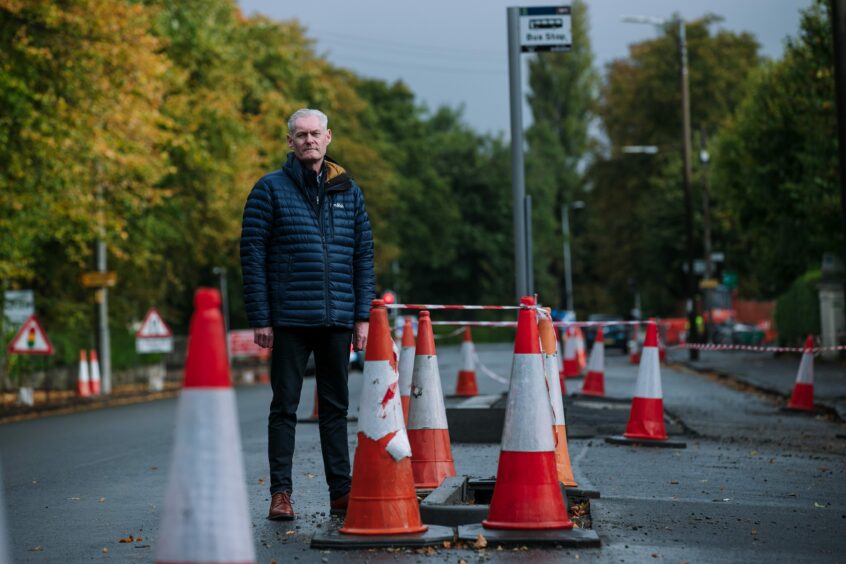 Road safety expert Neil Greig inspects the cycle lanes being built beside Pollok Park