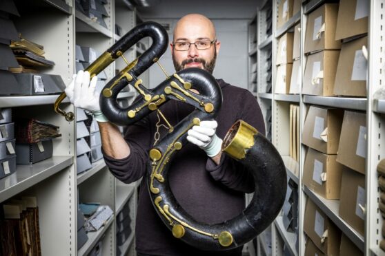 Stuart Harris-Logan with 1840s serpent from the Royal Conservatoire of Scotland’s collection