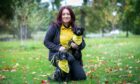 Chloe Barker with Dandy and Beano, two pups currently fostered under the Dog Trust’s fostering scheme, at Camperdown Park, Dundee