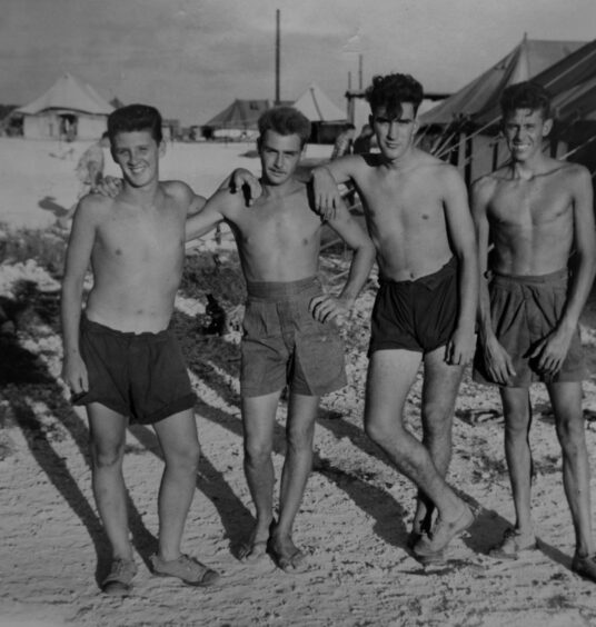 Ken McGinley, left, enjoys some downtime with his Army colleagues while serving on Christmas Island in the Indian Ocean in 1958