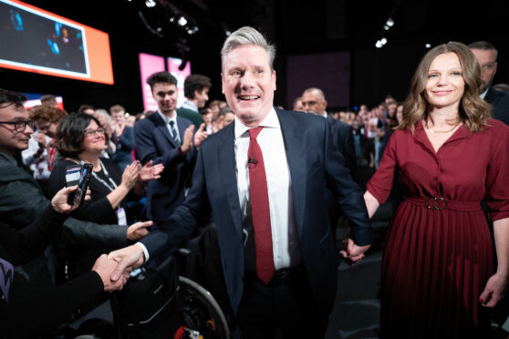 Labour Party leader Sir Keir Starmer, with his wife Victoria, leaves the stage after giving his keynote address at the Labour Party Conference