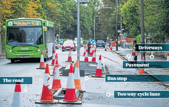 Part of the extensive work under way in St Andrews Drive in Glasgow shows the new two-way cycle lanes, “floating” bus stops and road separated from both drives and pavements