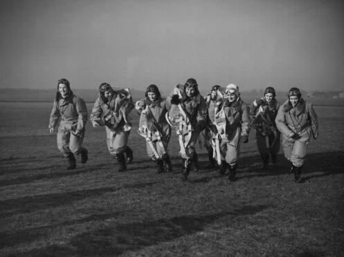 The Air Transport Auxiliary’s first elite female pilots, dubbed the Atta Girls, from left, Joan Hughes, Margaret Cunnison, Rosemary Rees, Mona Friedlander, Winifred Crossley Fair, Gabrielle Patterson, Margaret Fairweather,  and Marion Wilberforce in 1940. The Atta Girls flew planes like the Spitfire from factories and repair shops to frontline airfields,  during World War Two.