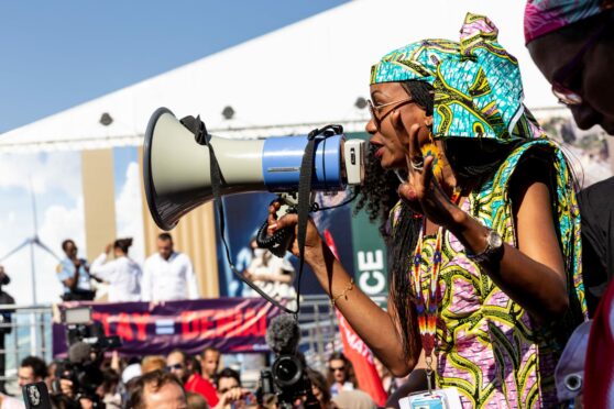 Activist speak to protesters demanding climate action and Loss and Damage reparations on the seventh day of the COP27 UN Climate Change Conference.