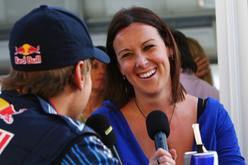 Lee McKenzie interviewing driver Sebastian Vettel at Japanese Grand Prix in 2009