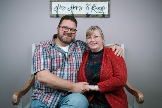Foster carers Iain and Elaine and Polk at home in Cumbernauld