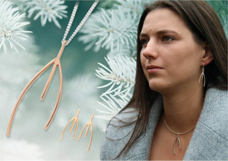 A woman next to a Karen Duncan jewellery necklace.