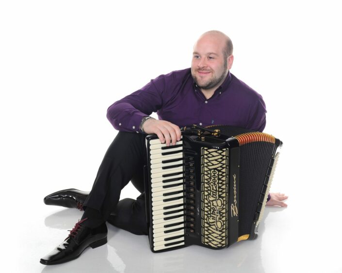 Musician Leonard Brown with an accordion.