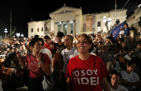A woman wears a t-shirt saying Yo Soy Fidel – I am Fidel – as hundreds of Cubans gather in Havana to mark the sixth anniversary of the death of Fidel Castro two weeks ago