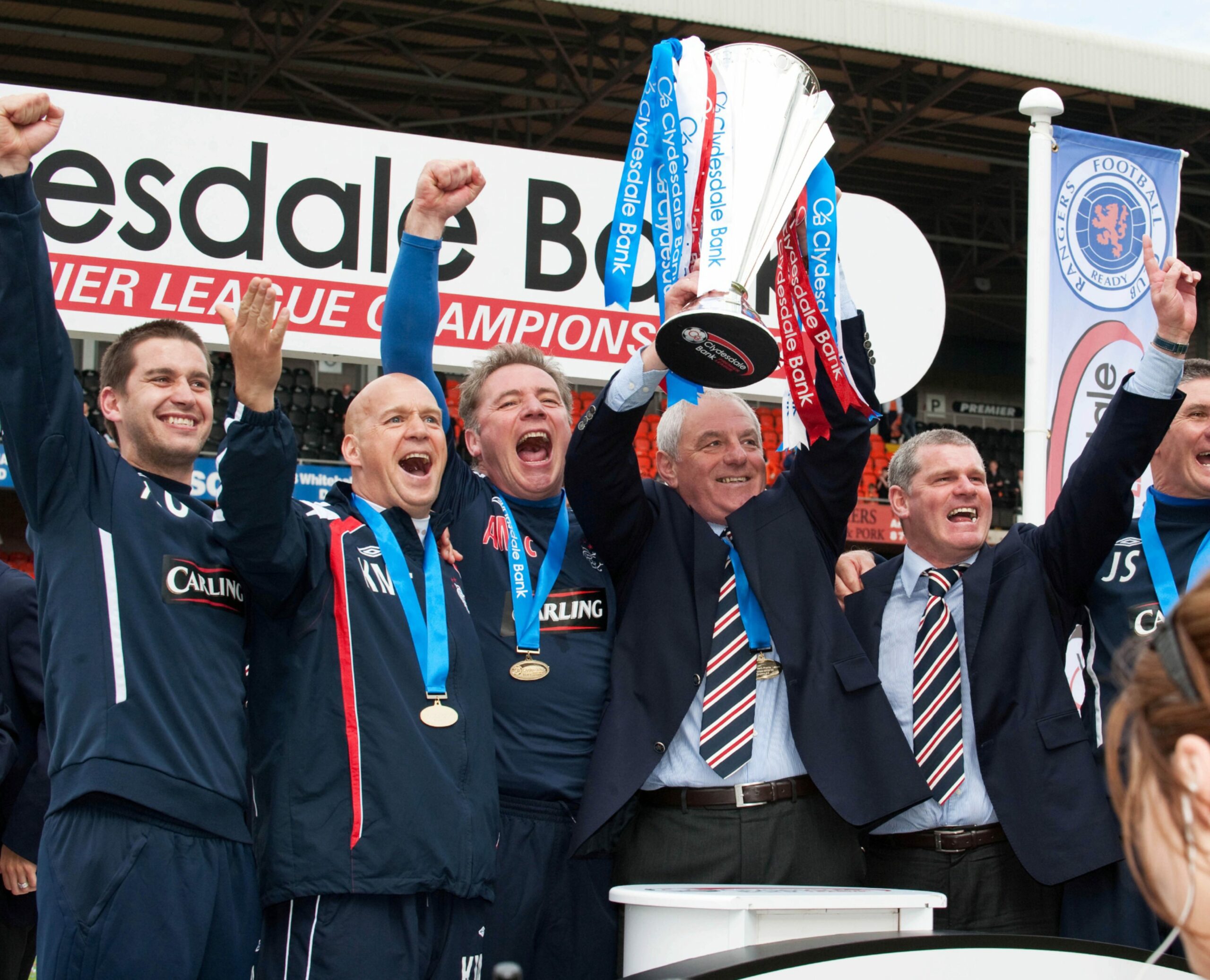 On either side of Walter Smith, Ally McCoist and Ian Durrant celebrate Rangers’ title win in 2011