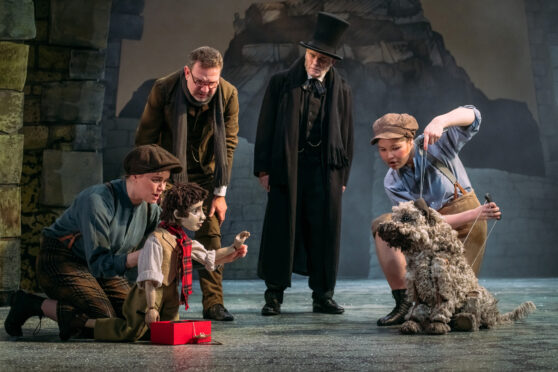 Crawford Logan, second right, stars as Ebenezer Scrooge, along with a puppet version of Greyfriars Bobby