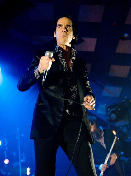 Nick Cave on stage during Halloween show at Barrowland Ballroom in 2013