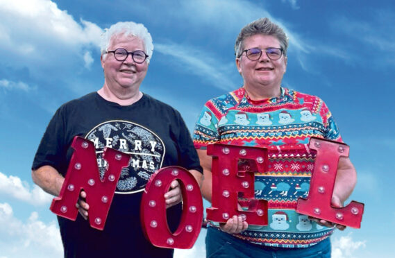 Val McDermid, left, and wife 
Jo Sharp, Scotland’s Geographer Royal, enjoy Christmas by the pool.