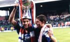 Rangers' Ally McCoist (left) and Ian Durrant celebrate with the League Cup trophy in 1993