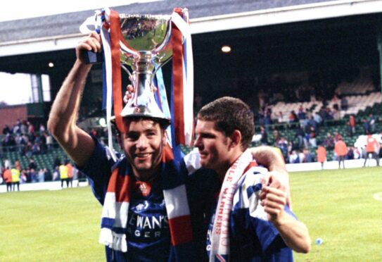 Rangers' Ally McCoist (left) and Ian Durrant celebrate with the League Cup trophy in 1993