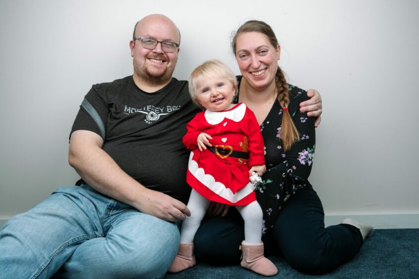 Baby Isabella with parents Richard Winfield and Margaret Paluszynska