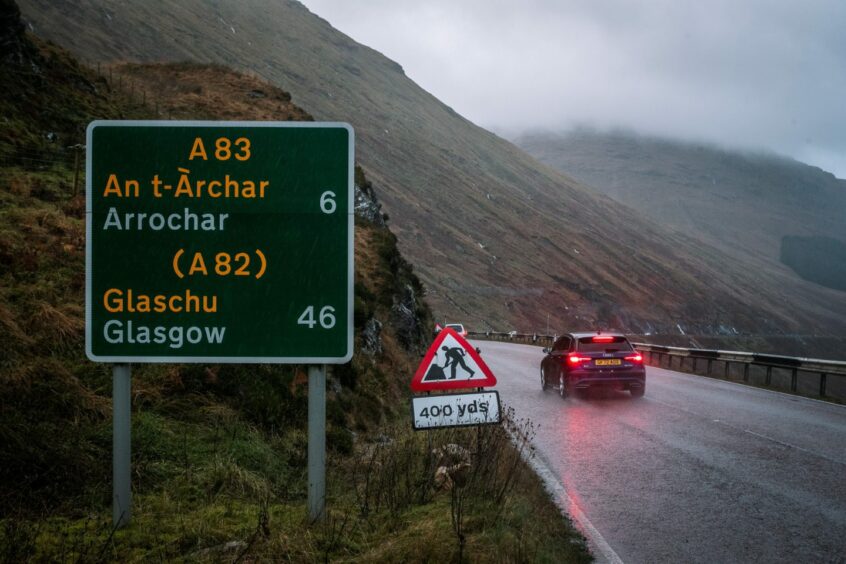 A roadsign on the A83 at the Rest and Be Thankful