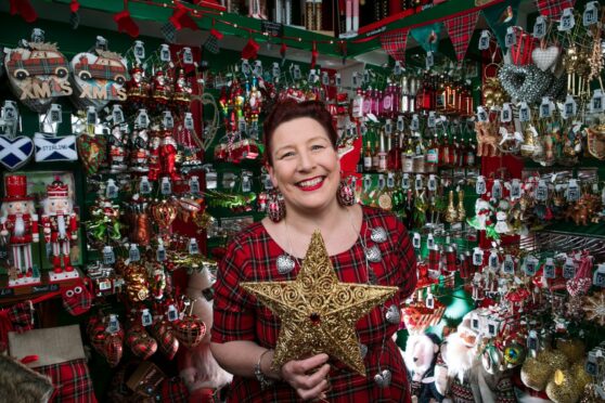 Lyndsey McDermott shows off some of the stars and baubles at her Tinsel & Tartan shop in Stirling.