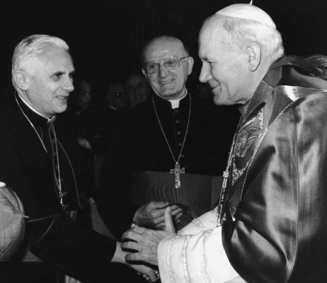 Pope Benedict meeting Pope John Paul II as Cardinal Ratzinger