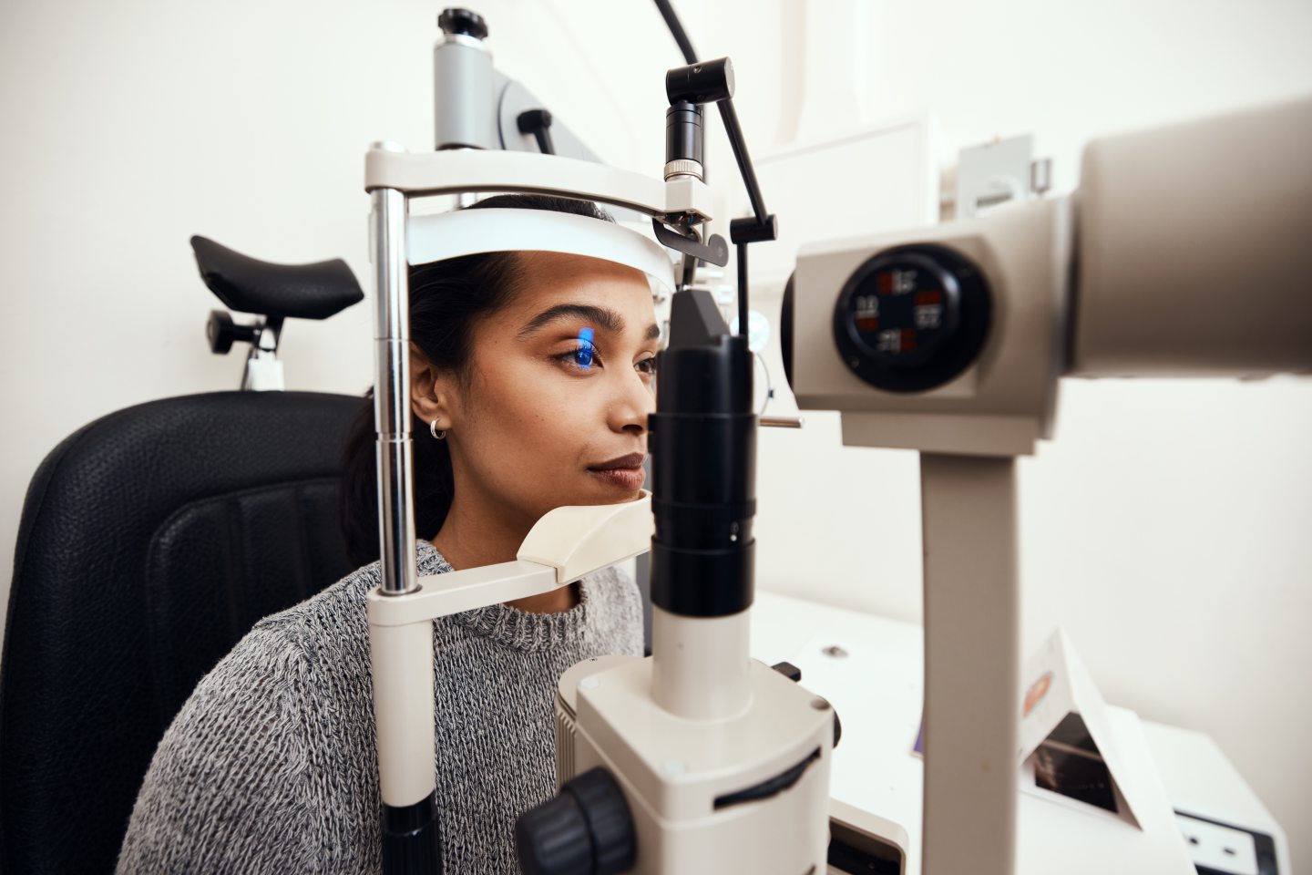 Woman getting eye test as part of essential NHS winter care