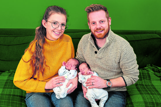 Charli and husband Hayden with twins Alfie, left, and Teddy at home in Moffat