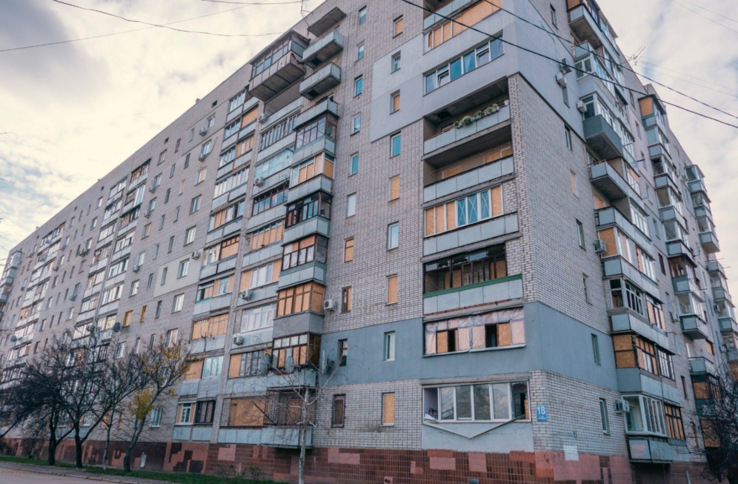 Windows are boarded up in the tower block where the Kotlyarovs will spend Christmas