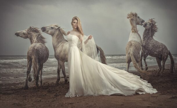 A model, above, showcases a bridal dress design by Mette Baillie.