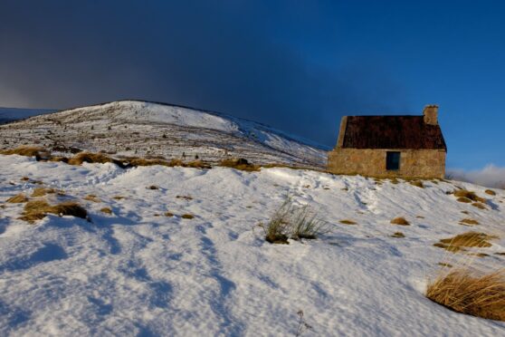 Ryvoan bothy on ancient drovers’ route in Pass of Ryvoan, Cairngorms, and Fiona on a snowy Ben Wyvis