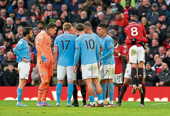 Bruno Fernandes celebrates his goal last Saturday while City’s players complain to the referee.