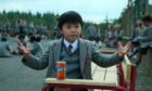 Schoolboy at fictional Crunchem Hall with vintage Irn-Bru in one of the scenes featuring the drink from Matilda the Musical