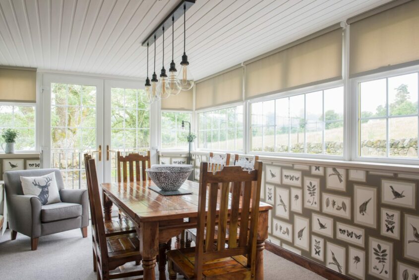 The Orchard Cottage's large windows let the outside in for Leny Estate guests.