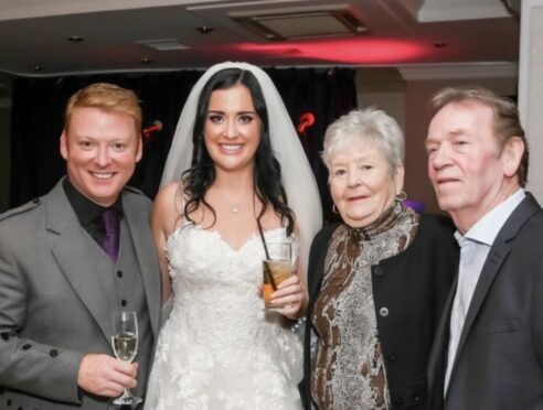 Gary and Cherylanne on their wedding day with Gary's dad John and mum Betty.