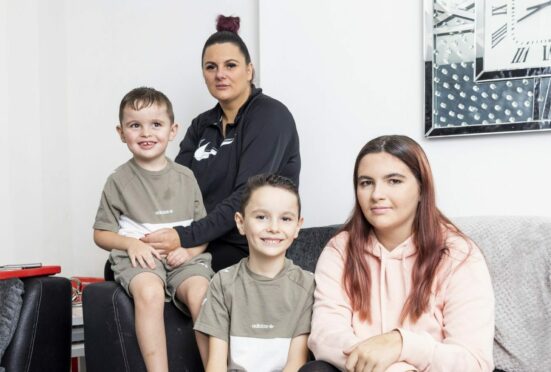 Stacey Lamb with her children Jack, Junior and  Kayla in family's new home.