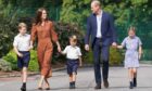 Prince George, Princess Charlotte and Prince Louis, accompanied by their parents the Prince and Princess of Wales