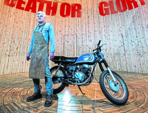 Artist Stephen Skrynka with his motorbike in The Revelator wall of death at Barclay Curle shipyard in Glasgow