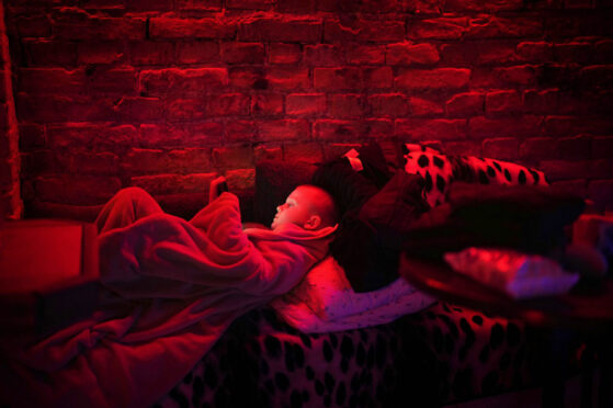 Six-year-old Svyatoslav takes shelter in a public basement in the capital as the first Russian missiles rain down on the city above