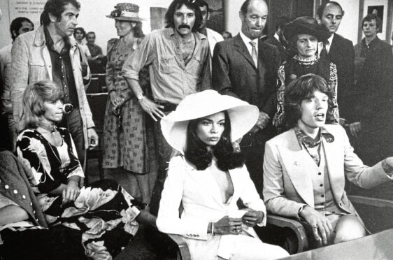 Bianca Jagger in famous white suit marries Mick in St Tropez.