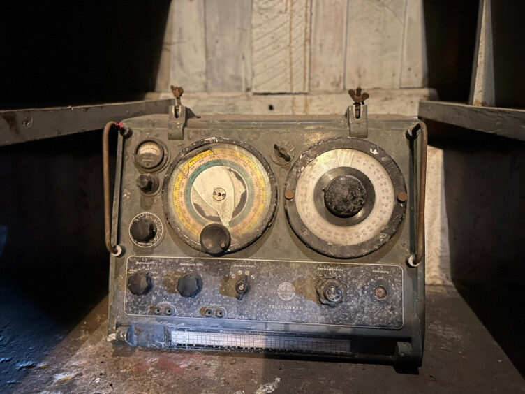 Old equipment in the store includes a radio direction finder 