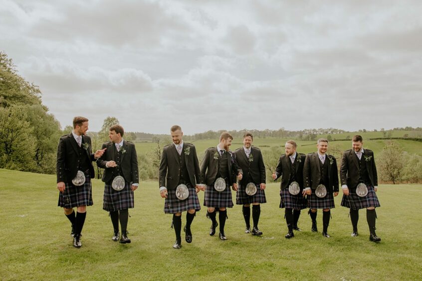 a group of men wearing kilts from Kiltpin Falkirk, one of the top Scottish wedding suppliers