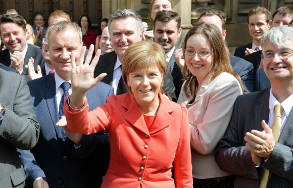Nicola Sturgeon stands with the SNP's 56 new members of parliament after General Election success in 2015