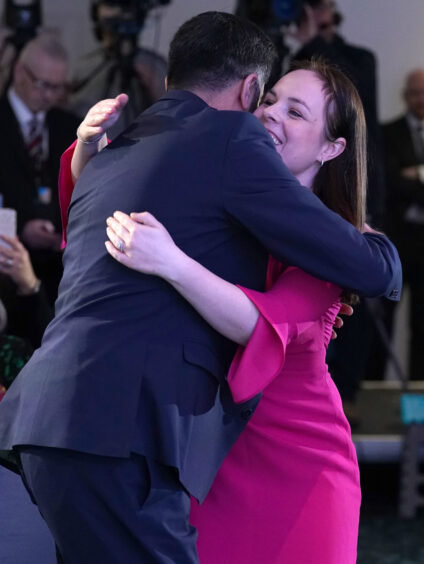 Humza Yousaf hugs Kate Forbes after the announcement