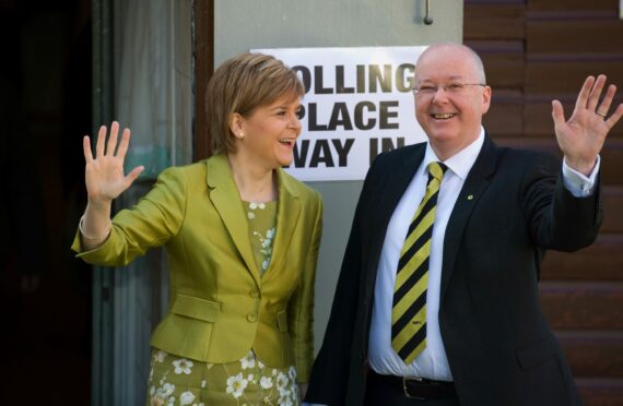 Peter Murrell and Nicola Sturgeon cast their votes at  polling station in Glasgow in 2015